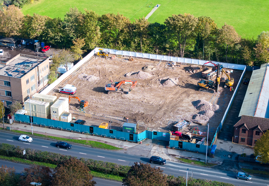 An aerial view of a large, fenced construction site.