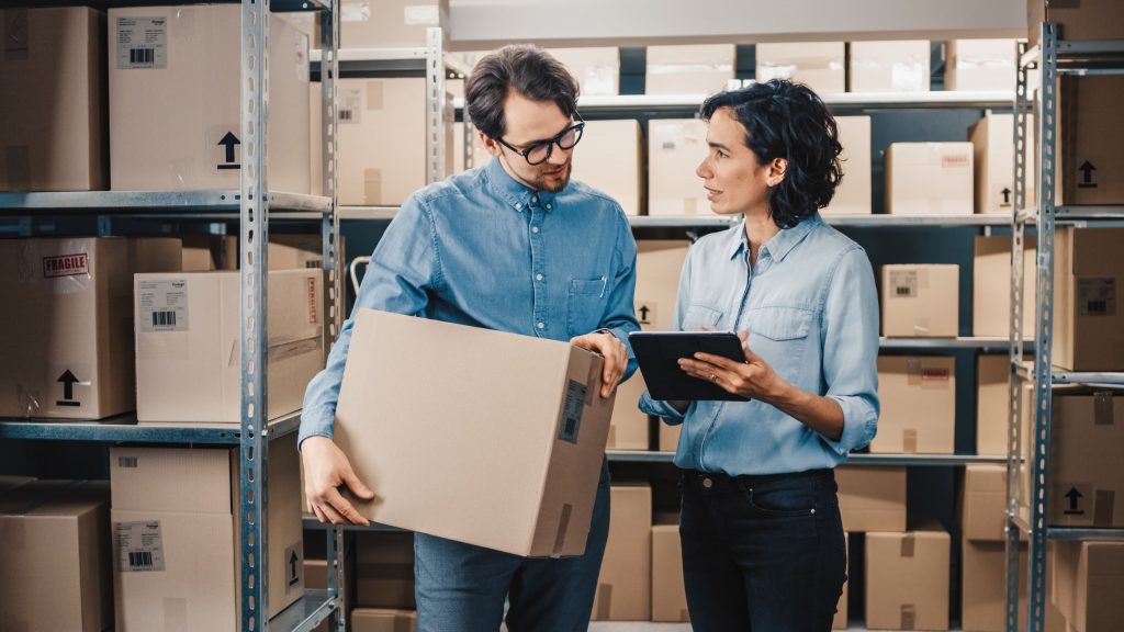 two employees talking in the business warehouse