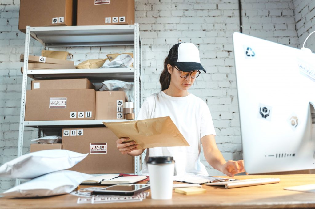 girl managing orders in warehouse